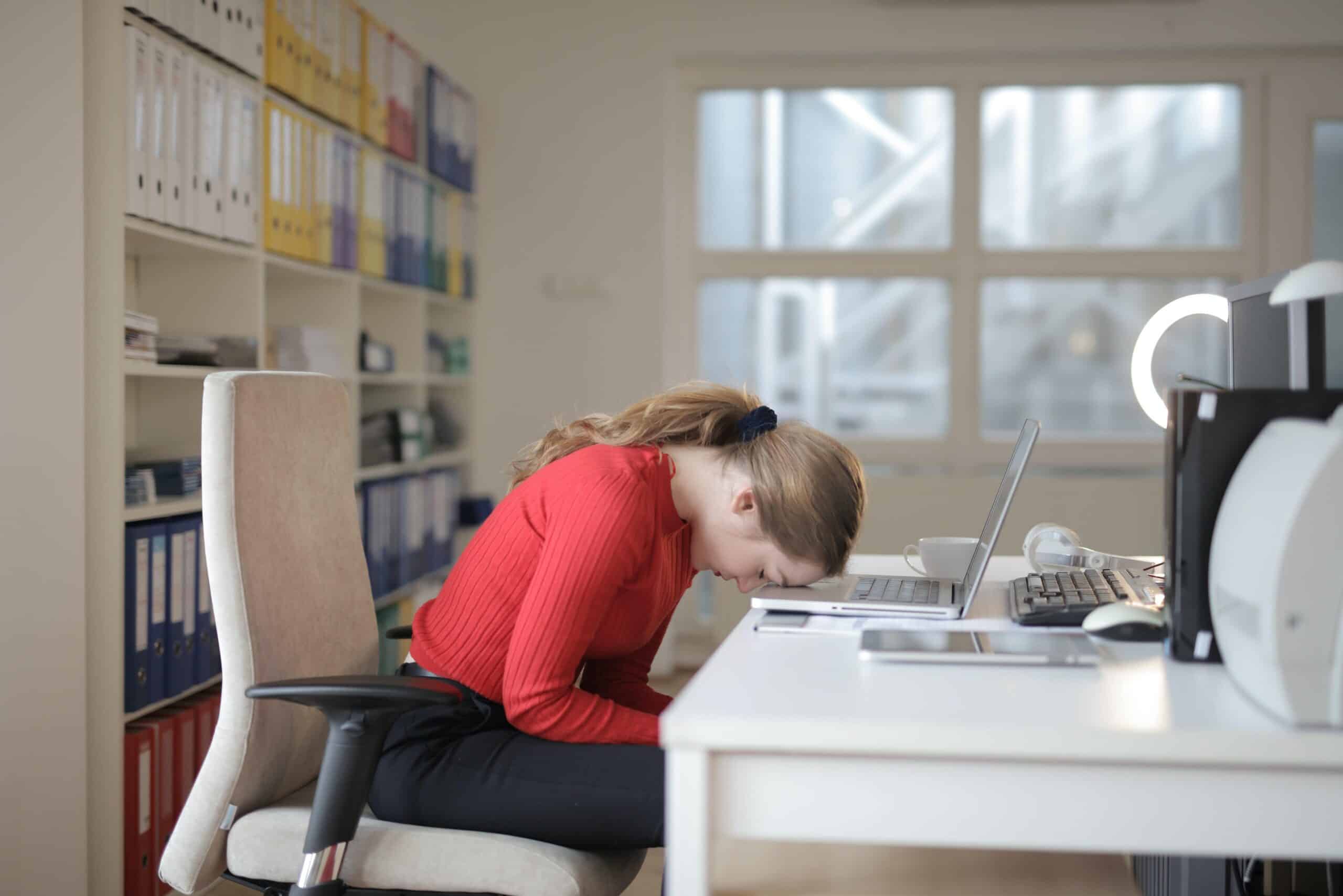 Women sat at desk frustrated