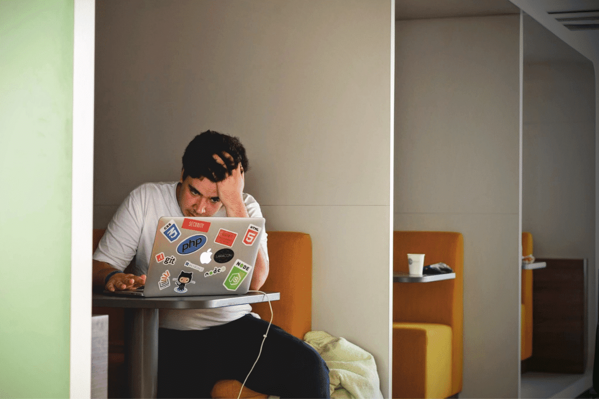 Stressed remote worker sat at their
